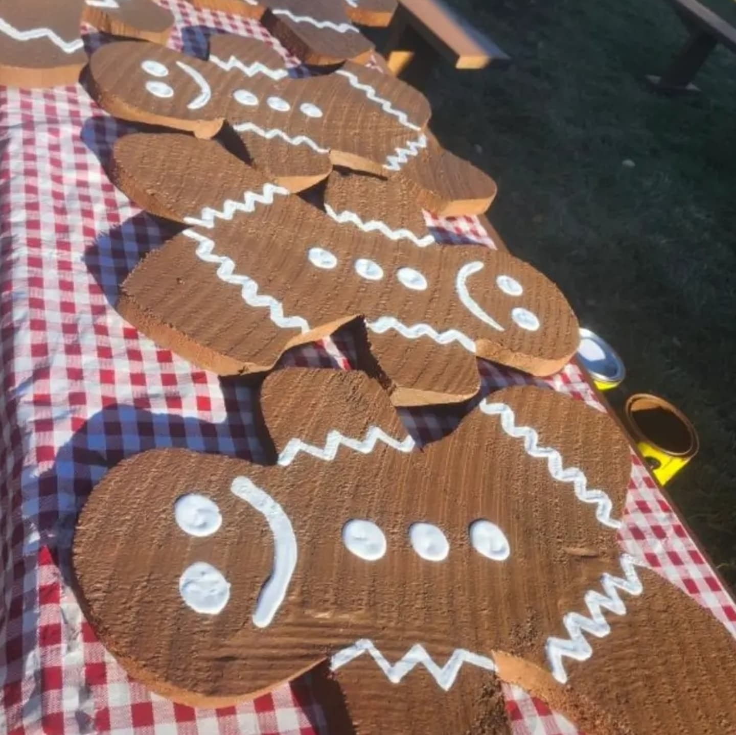 Decorated gingerbread men on checkered cloth