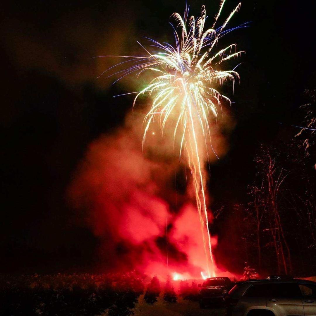 Fireworks exploding night sky celebration